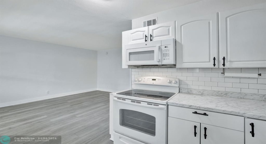 open concept kitchen/dining/living