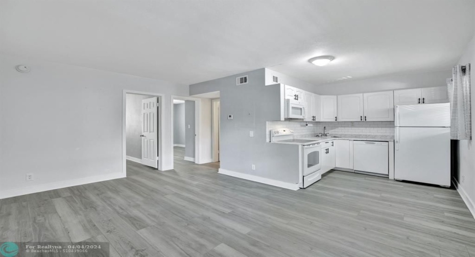 open concept kitchen/dining/living
