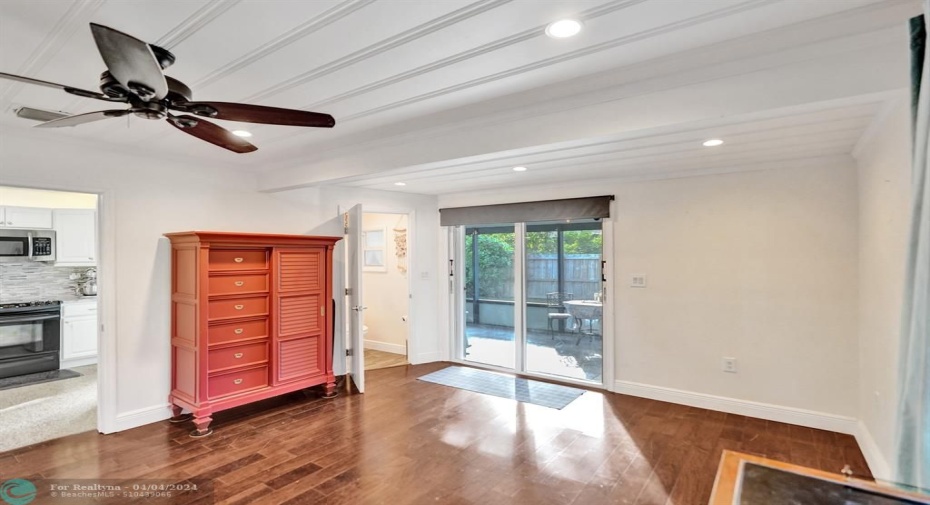 Optional Living Room Area or rent out with separate entrance and door lock accessibility to the rest of the house.  Patio Sliders leading to pool.