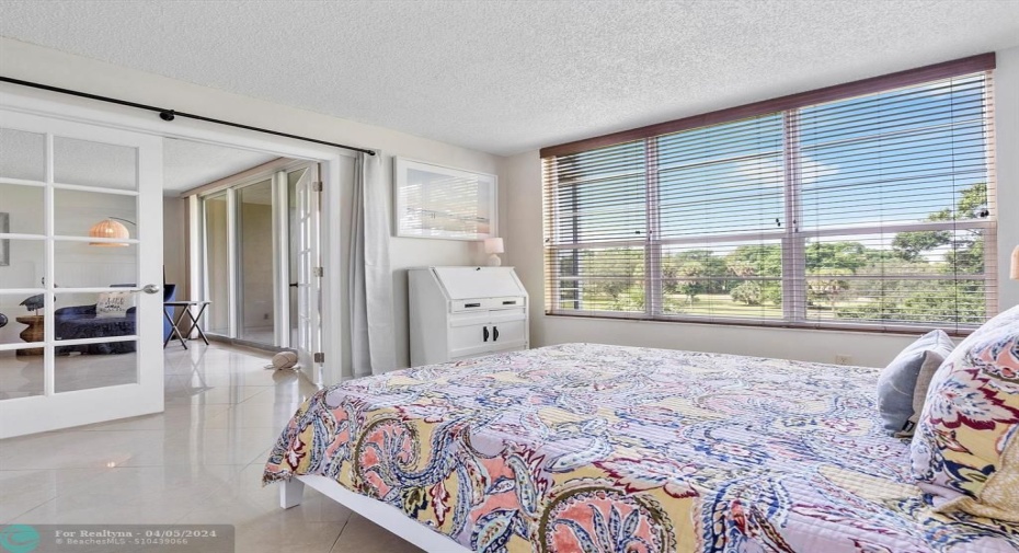 Bedroom towards back of condo (golf course view)