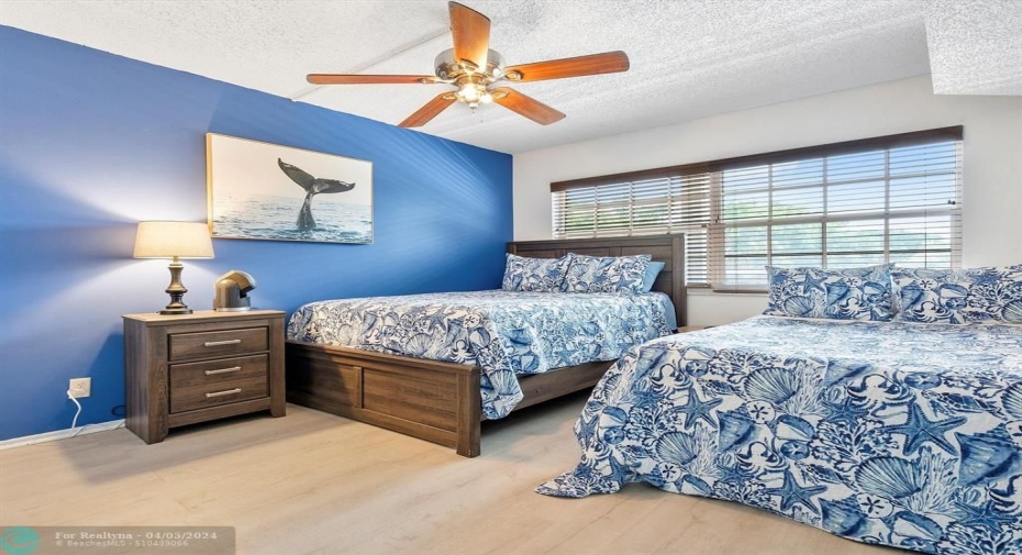 Guest bedroom towards the front of the condo, catwalk view