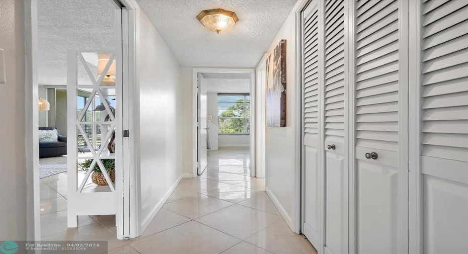 Full Sized Washer and Dryer behind the closet Doors, in hallway between guest bedrooms