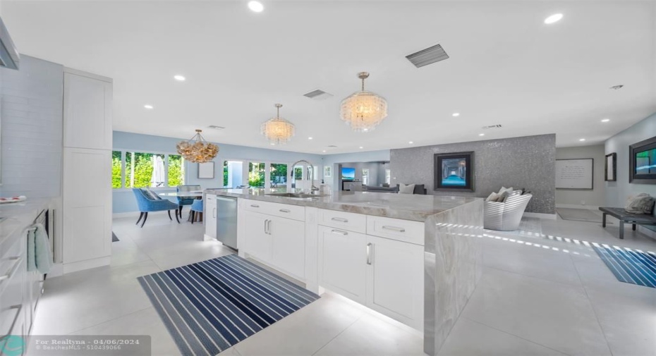 This kitchen is a show stopper, extra deep quartz waterfall counter and 131