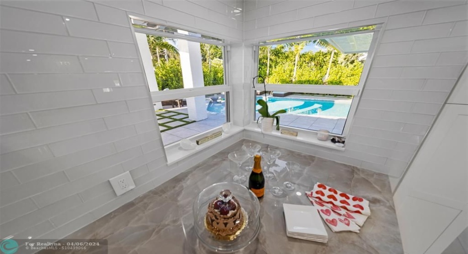 View from kitchen window to pool area.