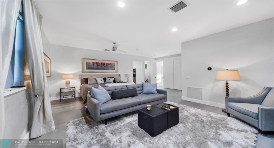 Primary bedroom suite on the second floor, high ceilings, electronic blackout shades