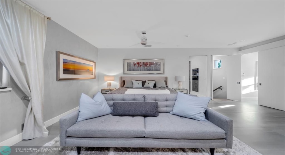 Primary bedroom, king sized bed, high ceiling, ceiling fan, primary bathroom to the right, master walk in closet just right of the night stand.