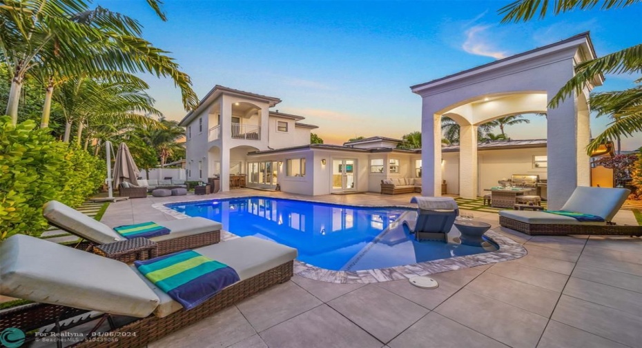 Color changing pool lights play for the perfect evening backdrop.