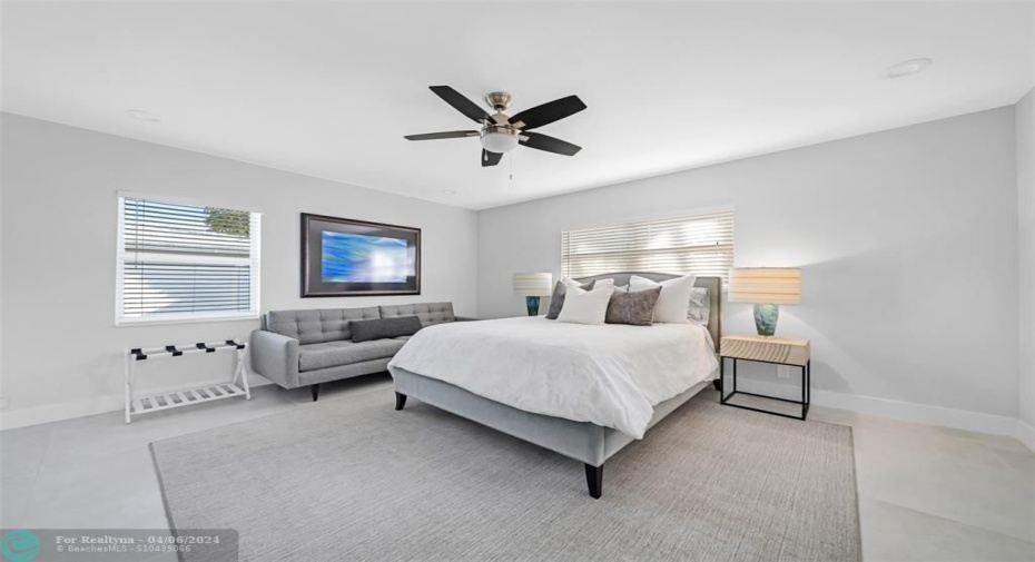 3rd guest bedroom with queen size bed, sofa, ceiling fan and en-suite bathroom.