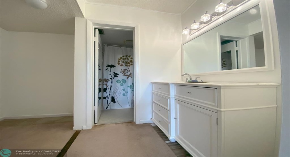 En suite bathroom and walk in closet.