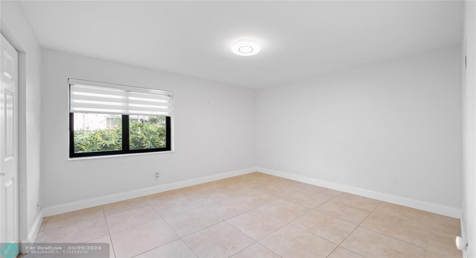 Rear bedroom/office/den - w/ full size closet.