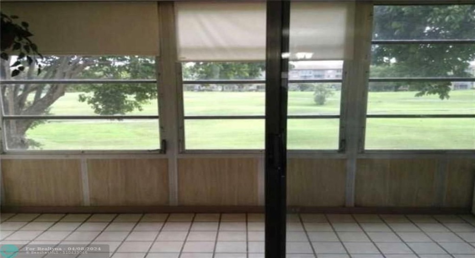 Enjoy Relaxing in this Enclosed Patio Overlooking the Golf Course