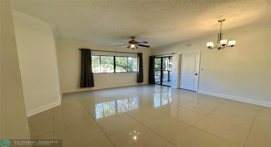 Spacious great room with dining area and plenty of natural light filtering in