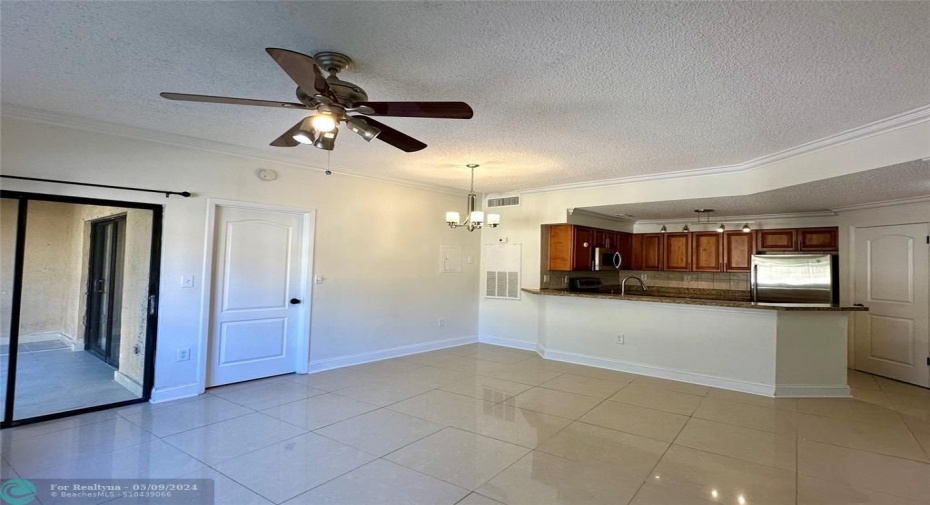 & snack counter area : room features upgraded baseboards & crown molding