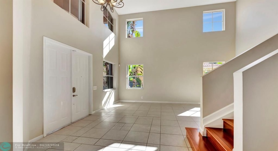Very high ceilings with many windows to create a light & bright space