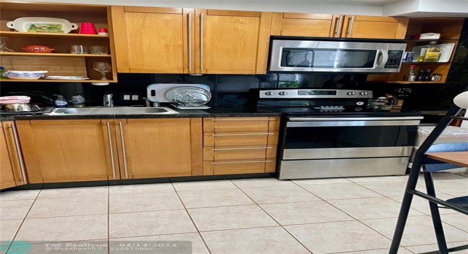 remodeled kitchen with stainless appliances and granite countertops