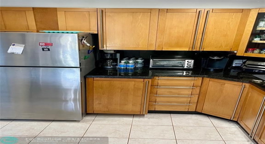 remodeled kitchen with stainless appliances and granite countertops