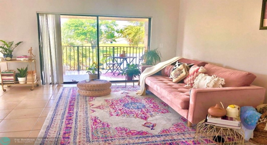 LIVING AREA WITH PICTURE OF SLIDERS LEADING TO YOUR BALCONY