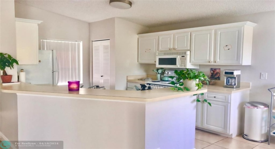 SPACIOUS KITCHEN THAT OPENS UP TO YOUR LIVING SPACE