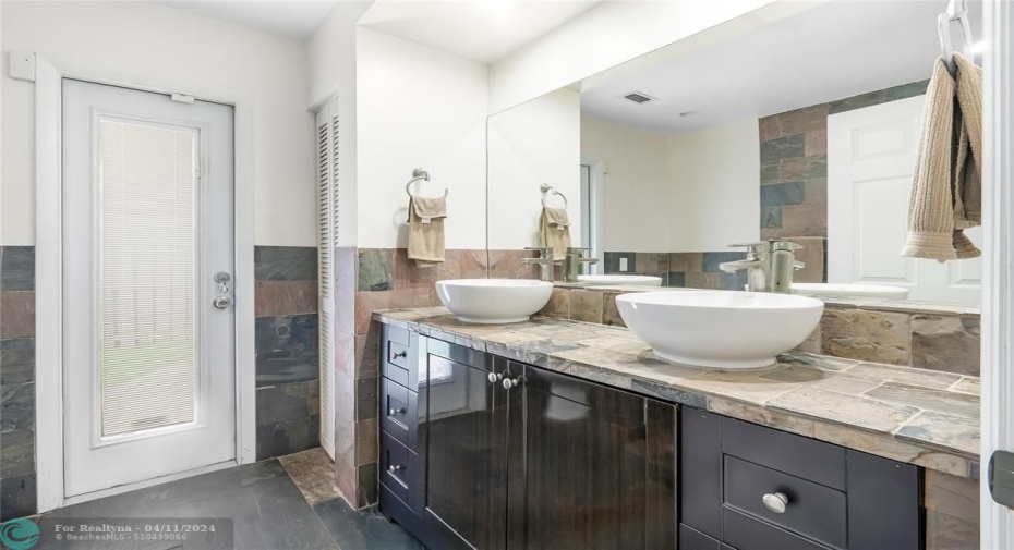 Full 3rd bathroom downstairs with exit to pool & side yard.