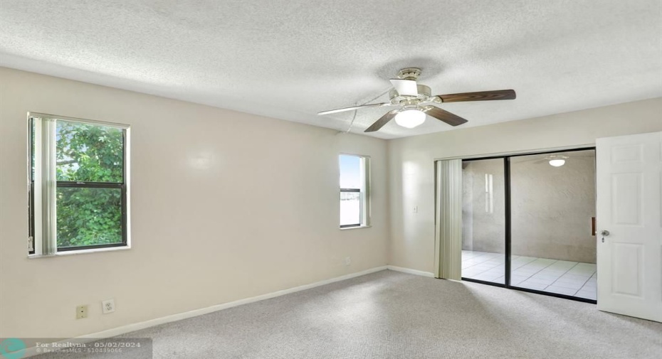 SLIDING GLASS DOOR TO BALCONY FROM MAIN BEDROOM