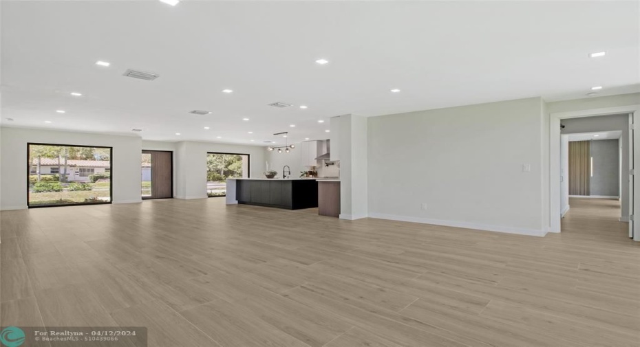 Living room, dining, kitchen from other end