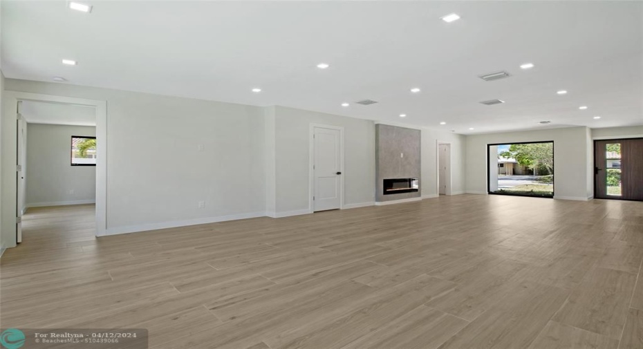 Living room, dining, kitchen from other end
