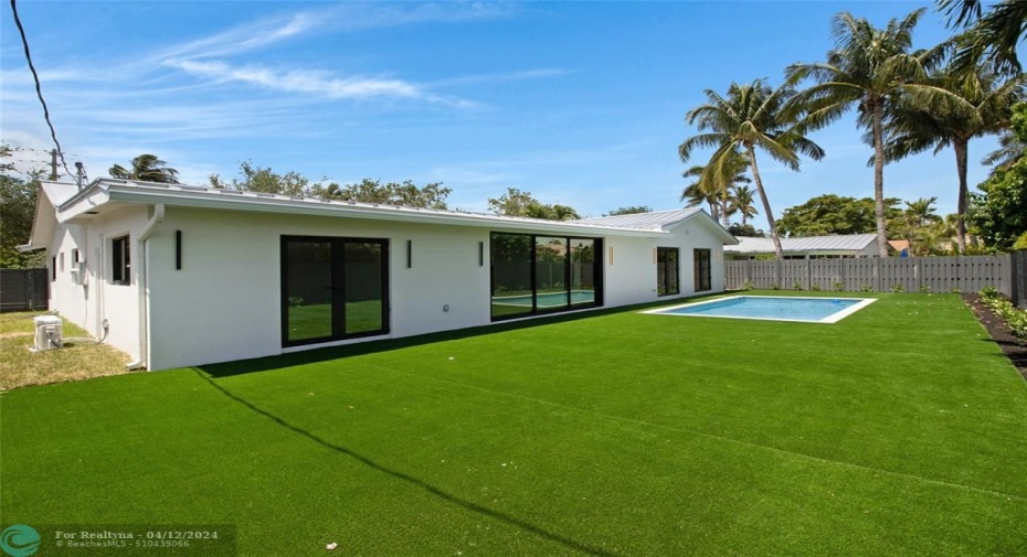 Large patio area with turf and brand new pool