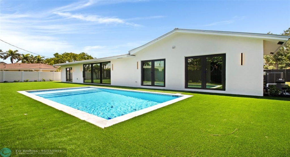 Brand new pool with turf and large patio area.