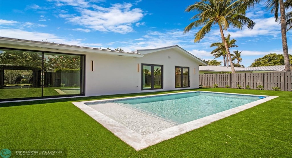 Brand new pool with turf and large patio area.