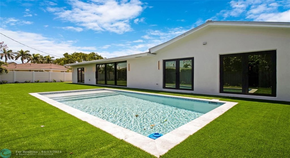 Brand new pool with turf and large patio area.