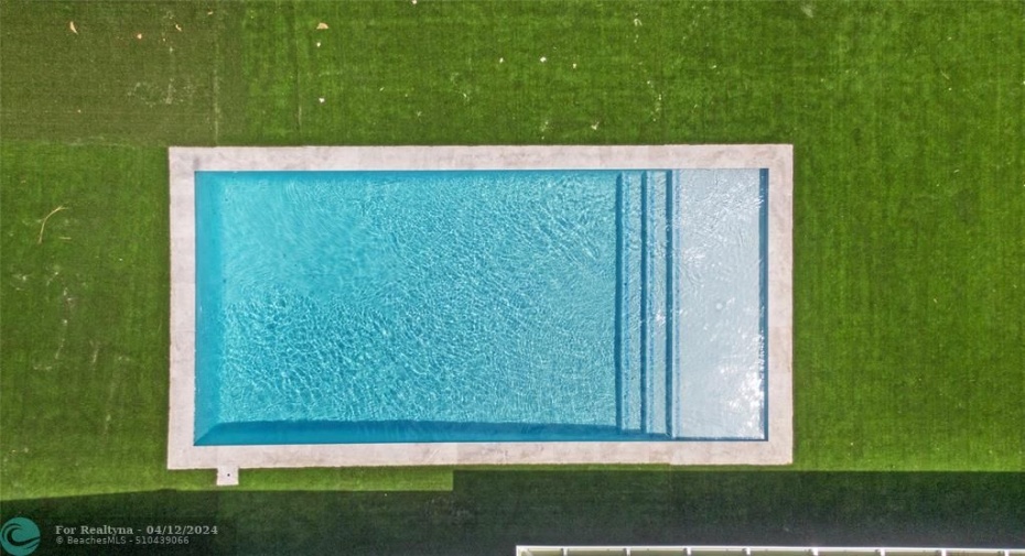 Brand new pool with turf and large patio area.