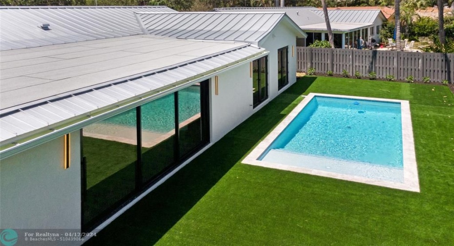 Brand new pool with turf and large patio area.
