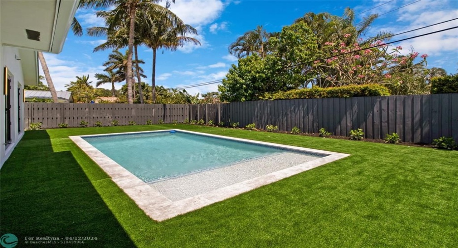 Brand new pool with turf and large patio area.