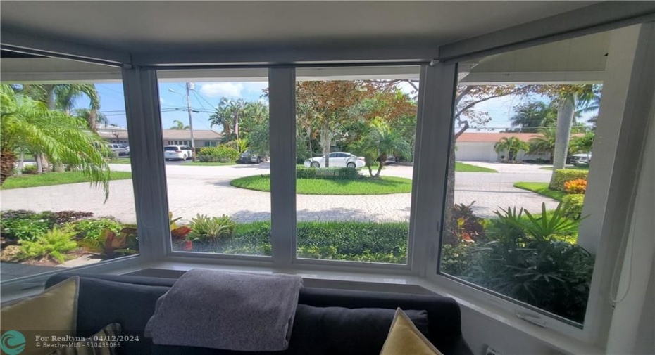 wide views to front of property....all impact windows and doors throughout the home...custom window treatments