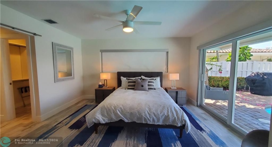 Master bedroom has very large sliding doors out to the pool area for morning or midnight dips