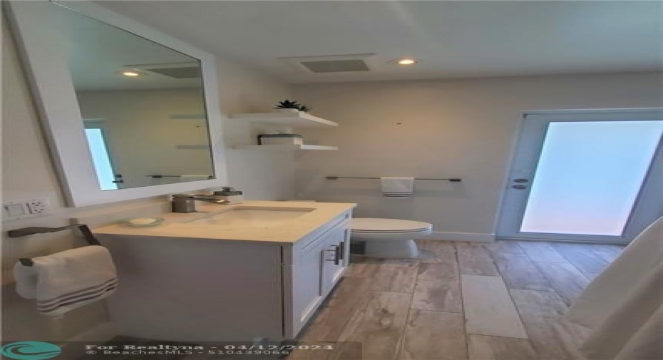 guest bathroom has a cabana bath door also to pool area for swimmers