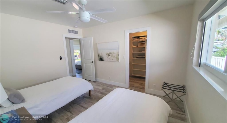 guest bedroom has walk in closet
