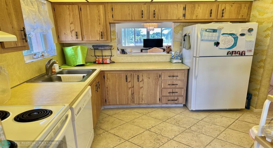 WHITE APPLIANCES IN KITCHEN & PLENTY OF STORAGE.
