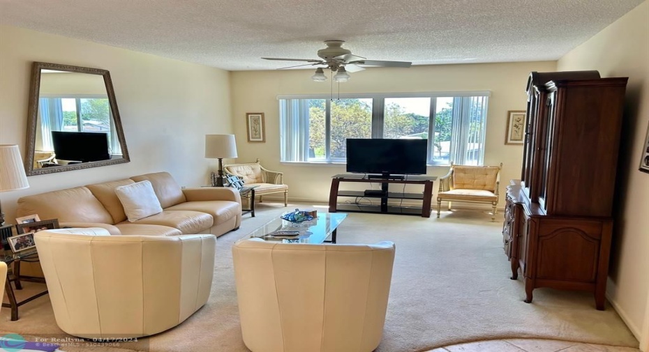 LIVING ROOM HAS BEAUTIFUL PLUSH OFF WHITE CARPETS IN GREAT CONDITION.