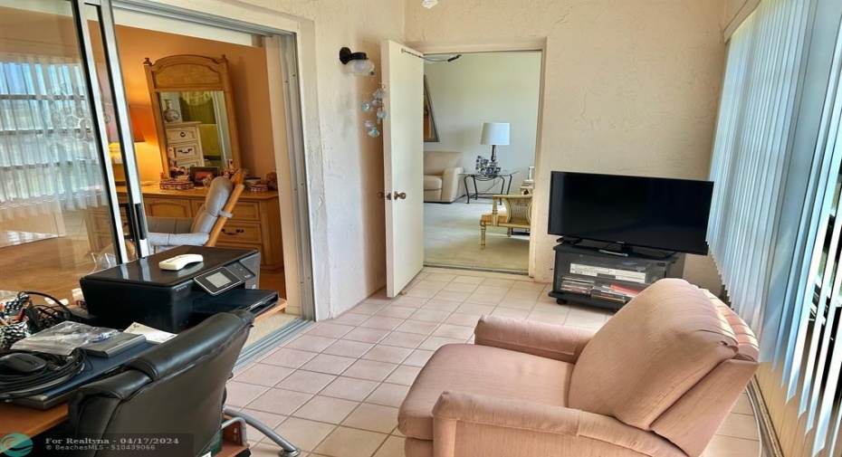 ENCLOSED PATIO GREAT FOR A TV ROOM, DEN OR OFFICE.