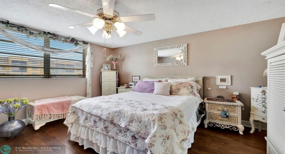 Spacious main bedroom, nice floors, neutral colors, view of lake, walk-in closet.