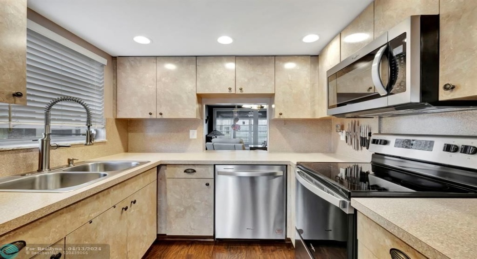 All newer SS appliances, updated recessed lighting. 2 windows in kitchen only on corner unit like this.