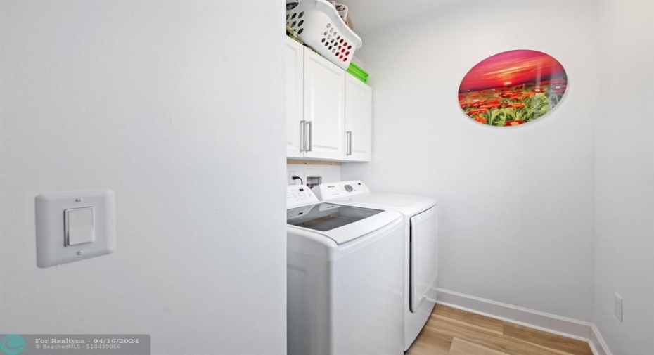 Laundry room off kitchen. Large capacity Samsung appliances