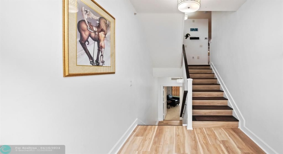Downstairs leads to 3 bedroom/office and outside. Level 2 kitchen/great room/Laudry. Third Level Primary Bedroom and 2nd office/bedroom