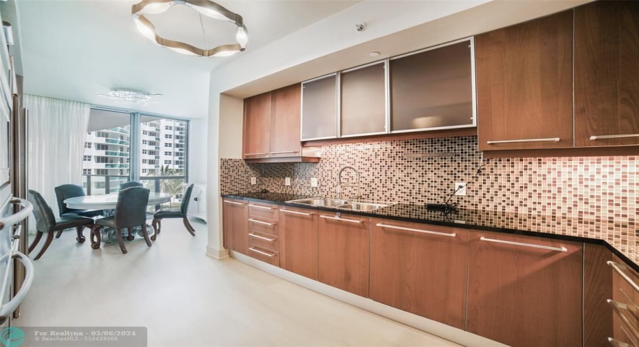 Kitchen looking at table and east balcony