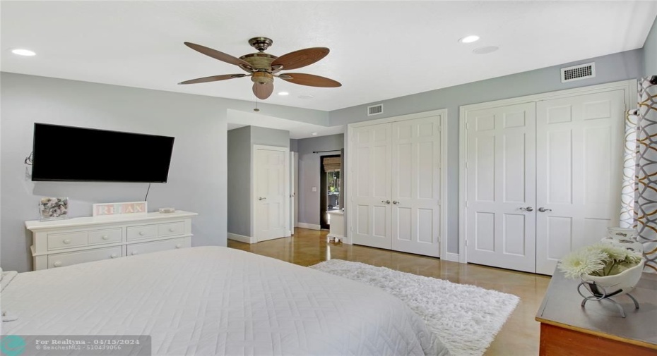 Gracious master offers onsuite full bath, his & her closets, private access to pool area from bedroom.