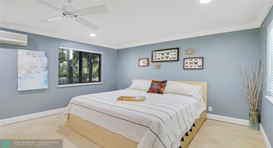 Guest bedroom with hall full bath and private access to pool area. Referring to this as the guest quatertes due to the hall has a door that closes it off from main living area.