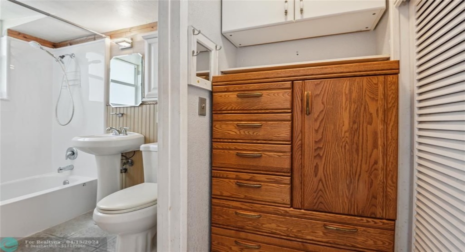 Bright bathroom with storage.