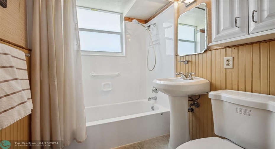 Bright bathroom with storage.