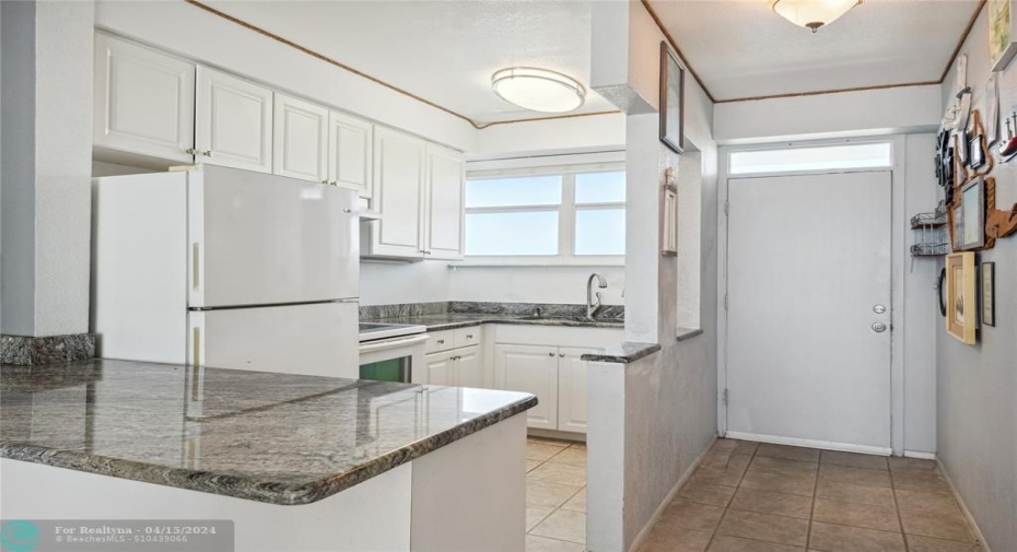 Bright kitchen that opens to your living room with a brand new range hood and oven that has never been used.
